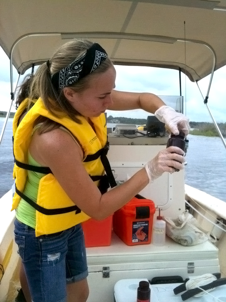 Kristine Peterson conducts in-field experiments aboard the Marine Science Lab's new boat.
